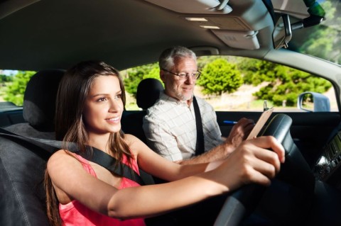 teen taking driving lessons