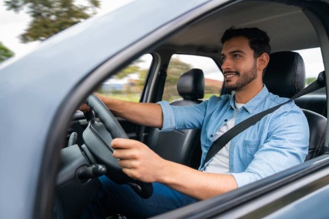 man driving car